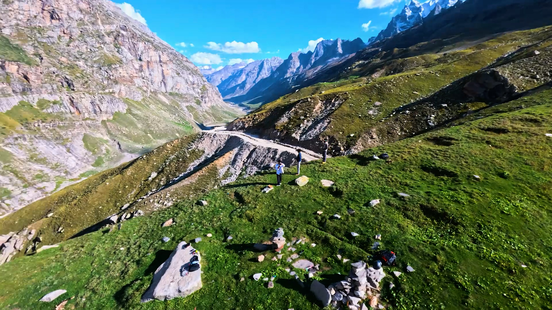 Long-range FPV drone footage gliding over a mountain valley